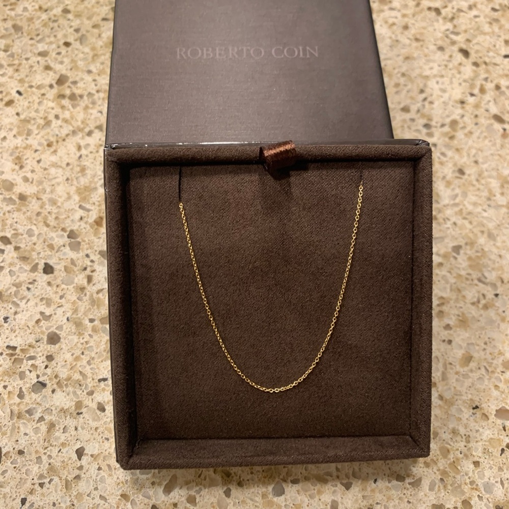 18kt solid yellow gold chain. Adjustable 16”-18”